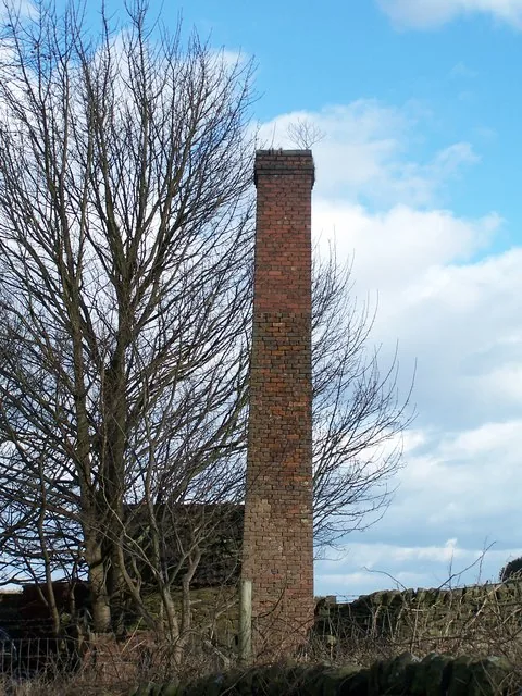 Close-up of a chimney damper handle inside a firebox